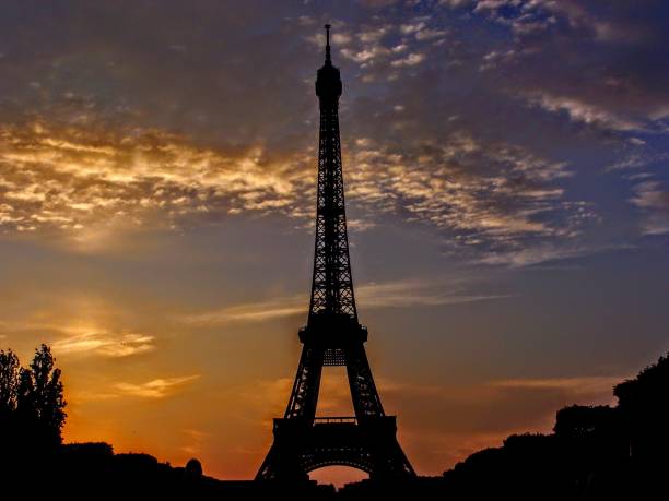 istock France, Paris, Tour Eiffel Tower Silhouette Sunset clouds orange blue 912825560
