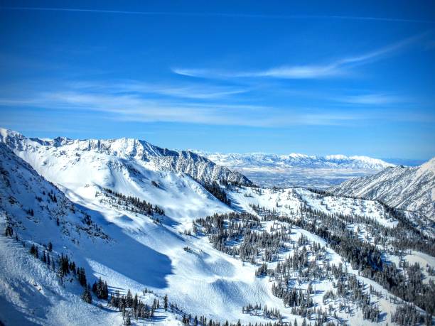 Winter Panoramic view of the back of the Wasatch Mountains Utah from the top of Brighton Ski Resort in the Rocky stock photo