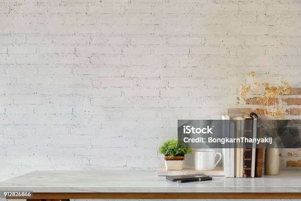 Marble Desk With Books Coffee Mug Mobile Phone And Plant Mock Up Stock Photo - Download Image Now