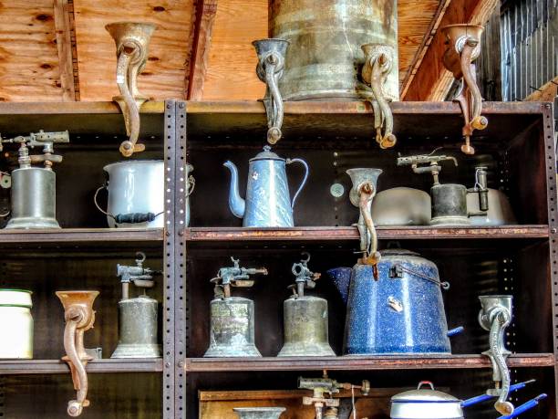 Antique Food Grinders and other kitchen items on shelves