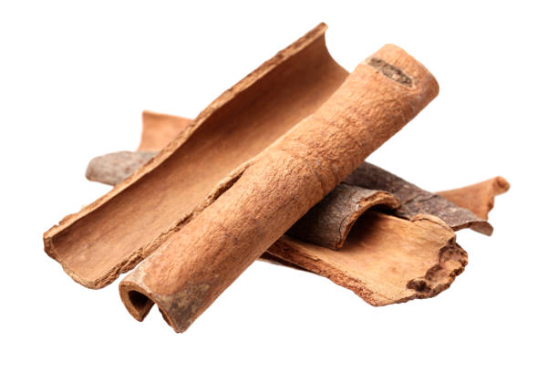 istock Cinnamon sticks closeup on the white background 912838608