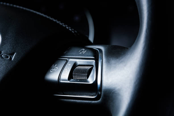 istock Cruise control and speed limiter buttons on the car steering wheel 912846308