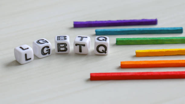 istock Alphabetic white cube of LGBTQ. Rainbow stick. 912848842