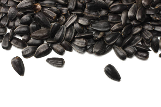 istock sunflower seeds isolated on white background. top view 912853220