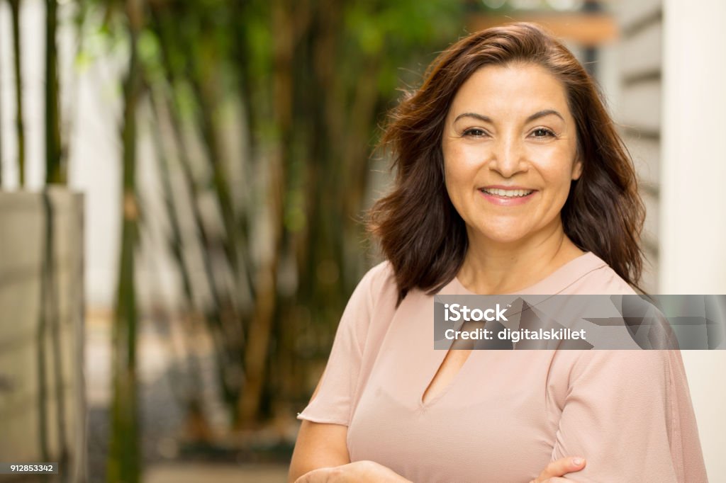 Happy Hispnaic woman smiling. Portrait of a happy Hispnaic woman smiling. Women Stock Photo