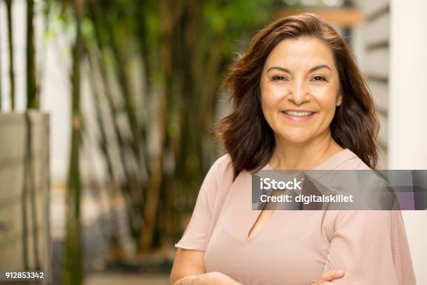 Happy Hispnaic Woman Smiling Stock Photo - Download Image Now - Women, Latin American and Hispanic Ethnicity, One Woman Only