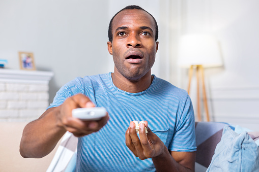 Man Using Remote Control Handsome Young Man Using Remote Control Stock Photo - Download Image ...