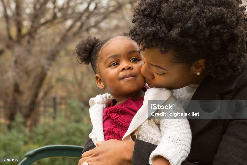 African American mother and her daugher. Happy African American mother and her daughter. Baby - Human Age Stock Photo