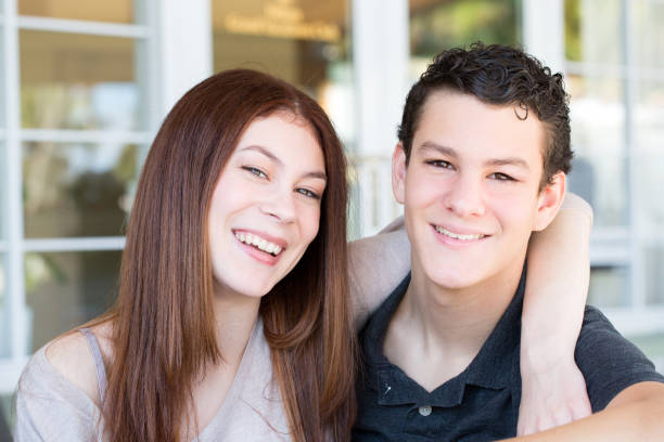 istock Portrait of a brother and sister smiling. 912855152