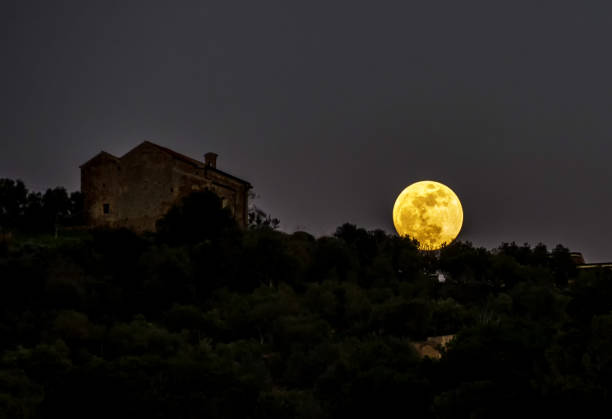 istock Full Blood Moon over Castallabate Italy 912858092