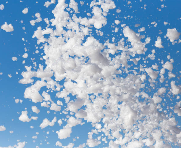 istock White foam against the blue sky as background 912867834