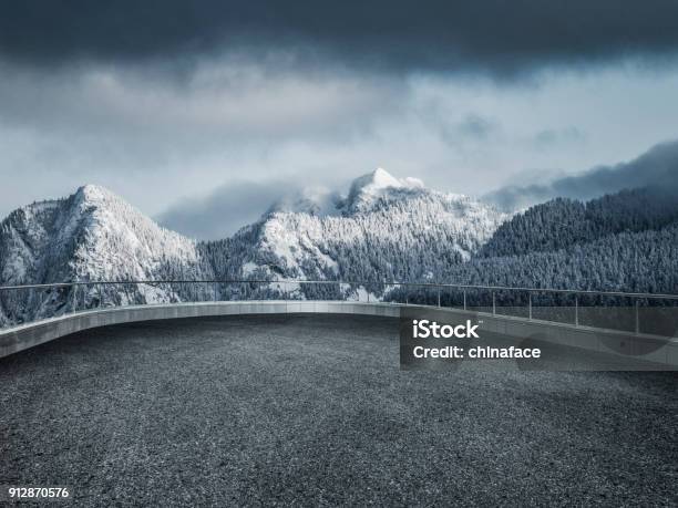 Winding Snowy Road Leading Towards Snow Mountains Stock Photo - Download Image Now - Observation Point, Snow, Mountain