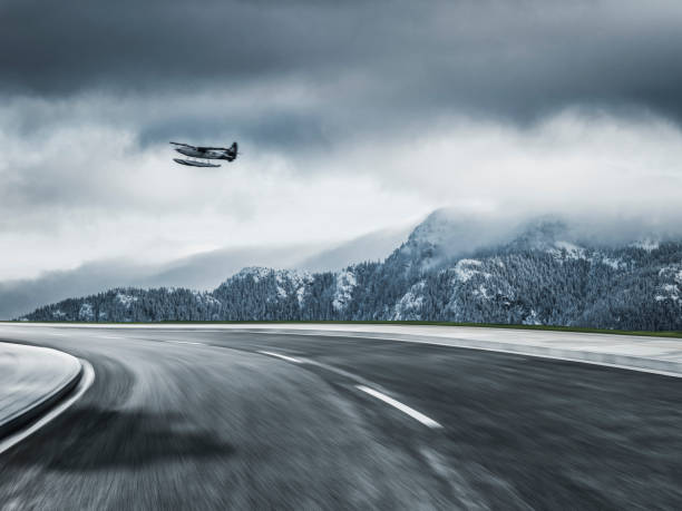 istock floatplane flying over snow mountains in Yukon,Canada 912870926