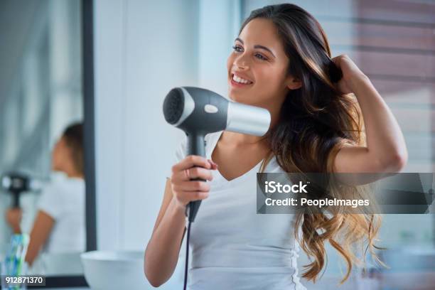 Putting Great Care Into Her Hair Stock Photo - Download Image Now - Hair Dryer, Hair, Women