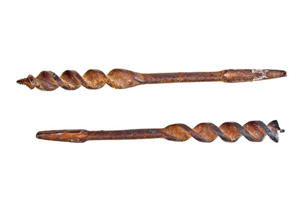 Old rusty drill bits on a white background Old rusty drill bits on a white background boreray and stac lee stock pictures, royalty-free photos & images