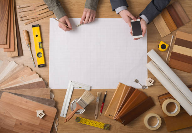istock Businessman and construction engineer working at desk 912872528