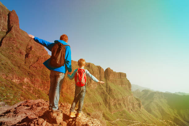 istock father and son hiking in scenic mountains 912872562