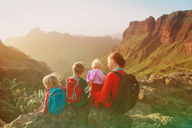 istock mother with three kids hiking in mountains 912872834