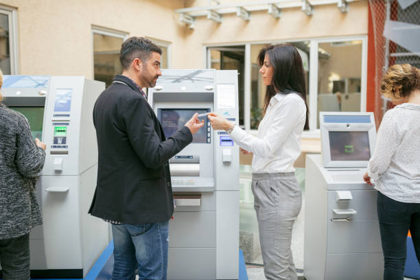 istock Couple exchananging credit card 912878840