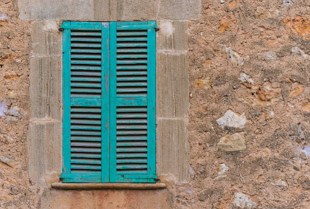 istock Vintage grunge window shutters and old wall 912879072