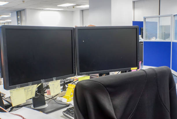istock two PC computer connecting monitor in office with chair for employee 912881992