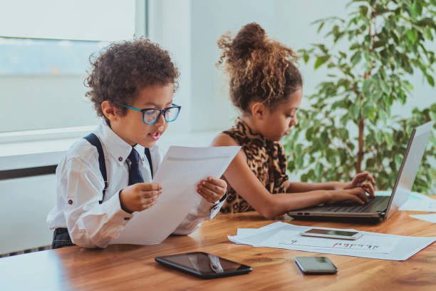 istock Cute boy and a girl working together as a team 912882778