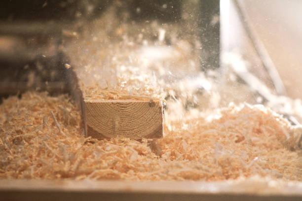 istock Process of sawing a board with a chain saw 912885712