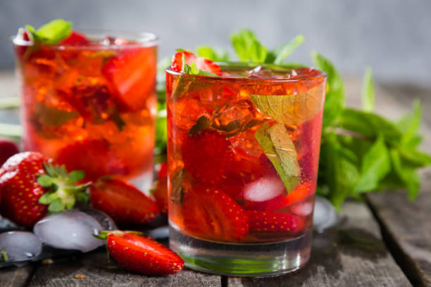 istock Strawberry mojito and ingredients on rustic background 912889834