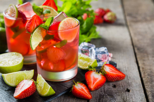 istock Strawberry mojito and ingredients on rustic background 912890116