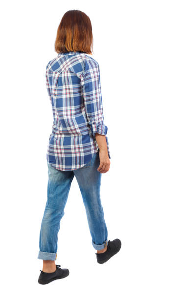 istock back view of walking  woman. 912890762