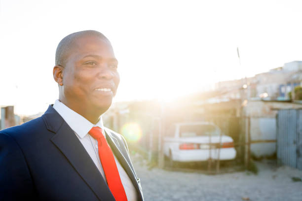 Portrait photo of a confident businessman outdoors