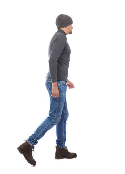 istock Back view of going  handsome man. walking young guy . 912891290