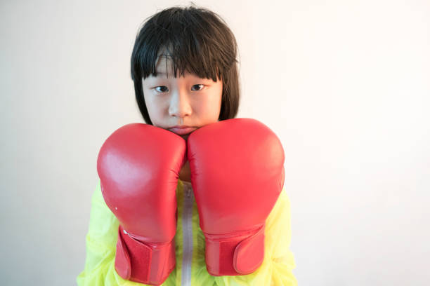 asian girl with red boxing glove with white background