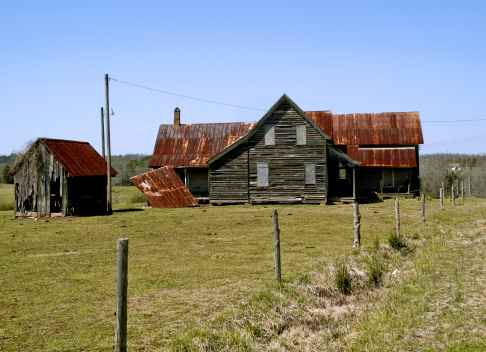 a broken down farm house beyond repair