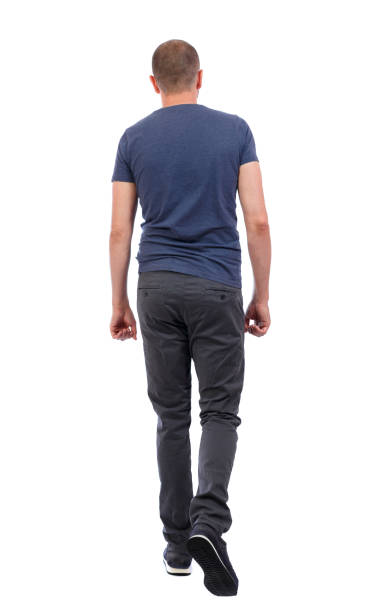 istock Back view of going  handsome man. walking young guy . 912893750