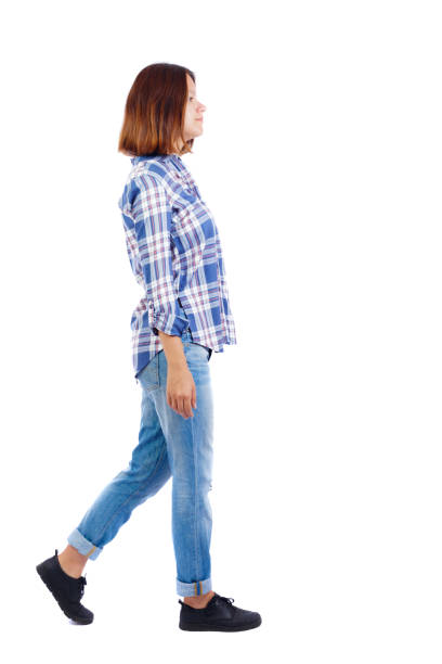 istock back view of walking  woman. 912894332