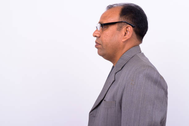 Young Indian businessman over white background