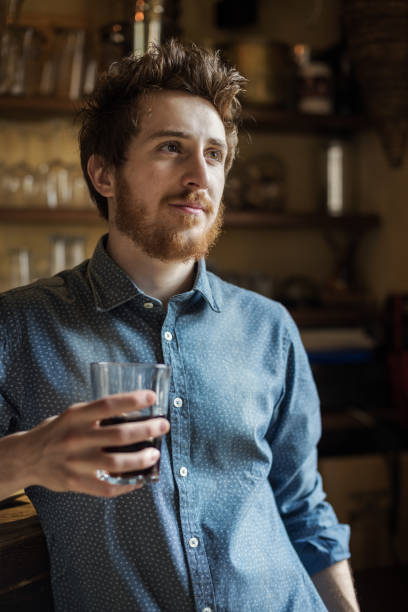 istock Hipster man drinking a glass of coke 912903664