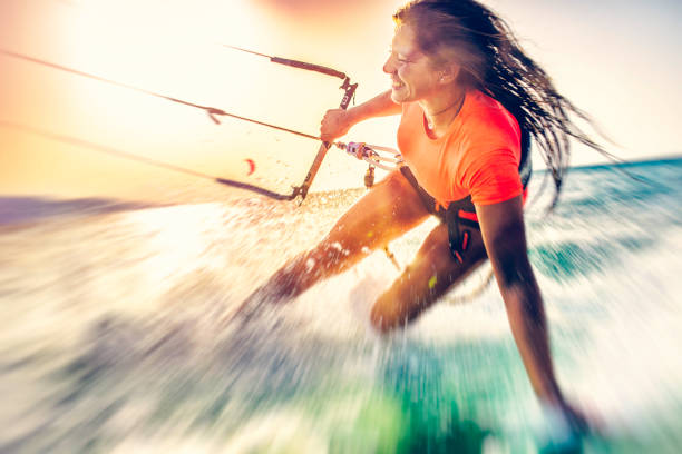 istock Smiling young female kiteboarder on the sea 912904234