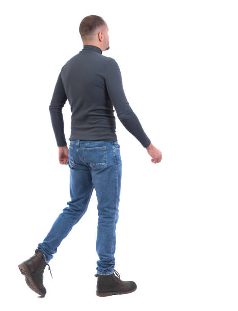 istock Back view of going  handsome man. walking young guy . 912907214