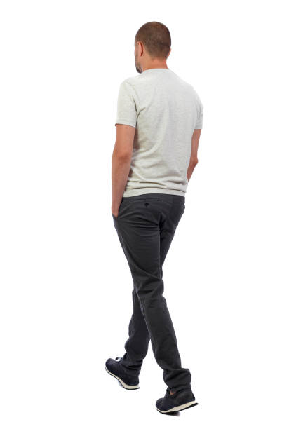 istock Back view of going  handsome man. walking young guy . 912907788