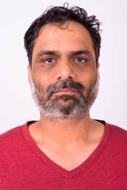 Close-up portrait of a man. Looking up into the corner.