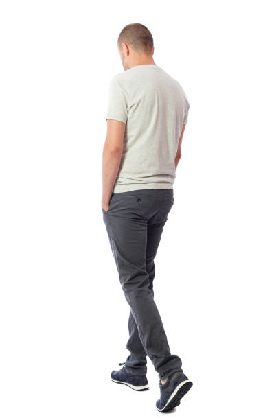 istock Back view of going  handsome man. walking young guy . 912907946