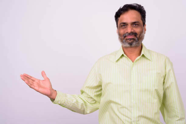 istock Portrait Of Indian Man Showing Copy Space 912910476