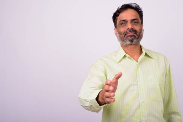 istock Portrait Of Indian Man Offering Handshake 912910636