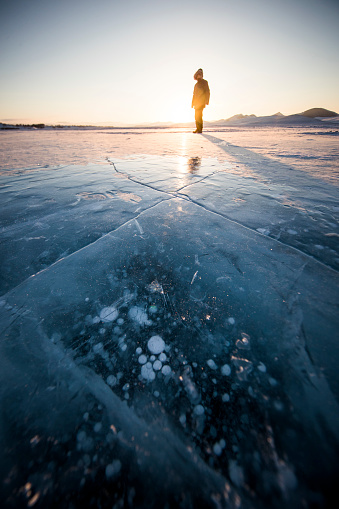 Man on a frozen lake