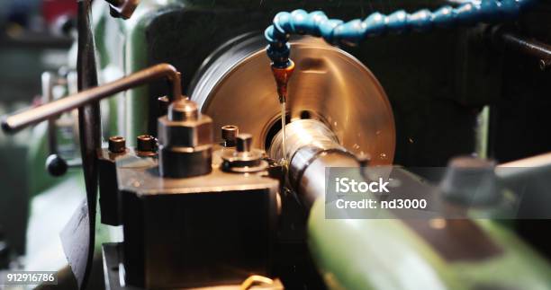 Finishing Metal Working On High Precision Grinding Machine In Workshop Stock Photo - Download Image Now
