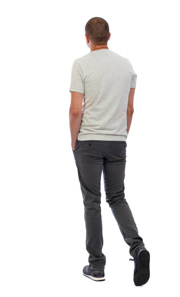 istock Back view of going  handsome man. walking young guy . 912919920