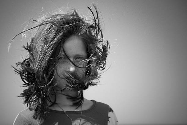 istock Red haired girl in the wind (B&W) 91292116