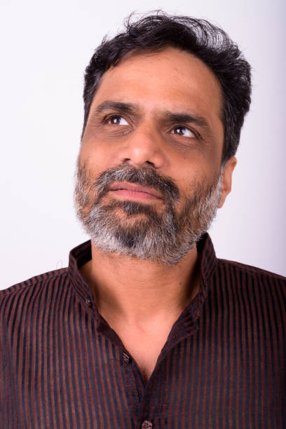 istock Portrait Of Indian Man Thinking Against White Background 912922862